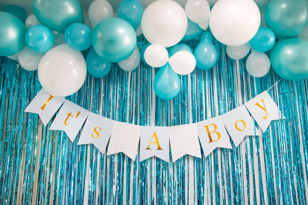 Baby shower welcome sign and gift table with pink and blue decor