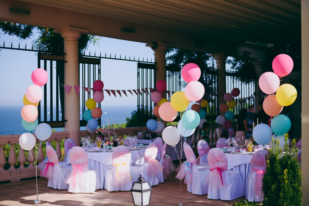 Affordable baby shower backdrop with streamers and paper lanterns